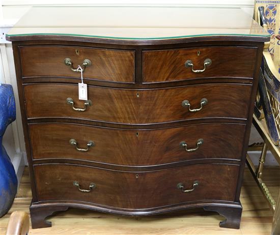 A George III style mahogany serpentine five-drawer chest W.99cm